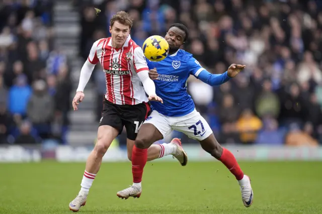 Southampton's James Bree (left) and Portsmouth's Millenic Alli battle for the ball