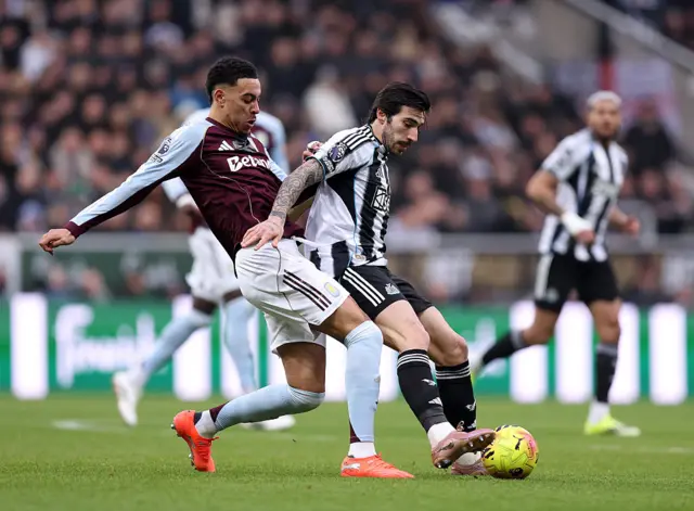 Sandro Tonali of Newcastle United is challenged by Morgan Rogers