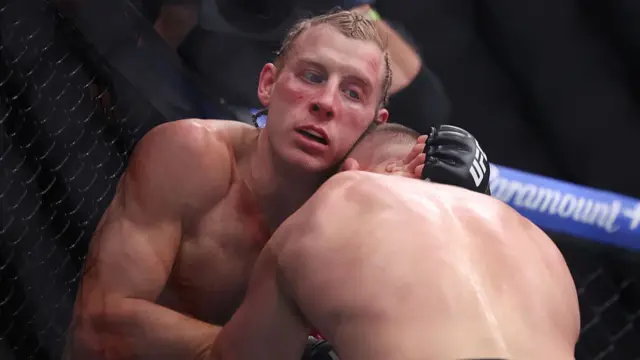 Paddy Pimblett of England and Justin Gaethje of the United States come together