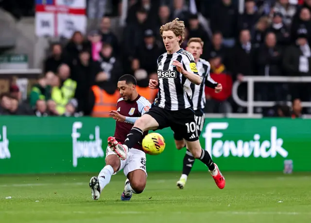 Aston Villa's Youri Tielemans passes the ball under pressure