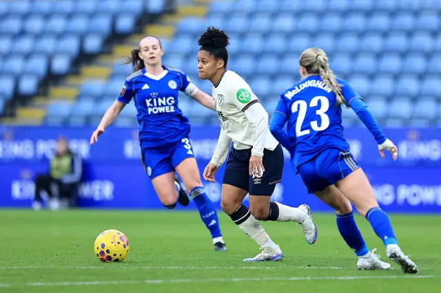 Shekiera Martinez runs with the ball