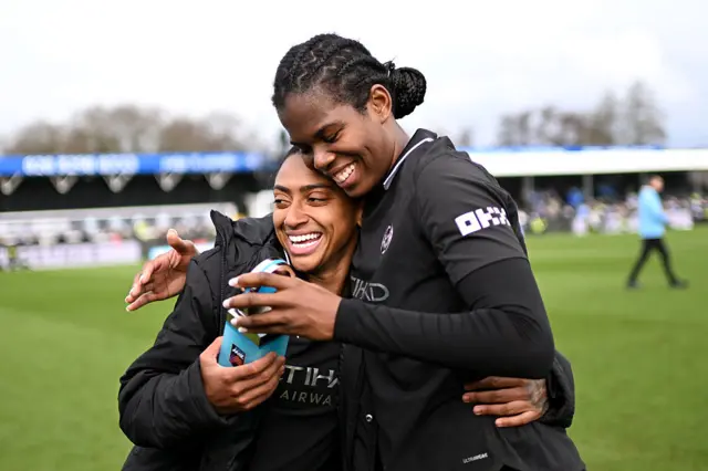 Bunny Shaw hugs Kerolin, who holds her player of the match award