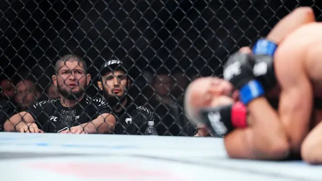 Khabib Nurmagomedov watching Gaethje v Pimblett
