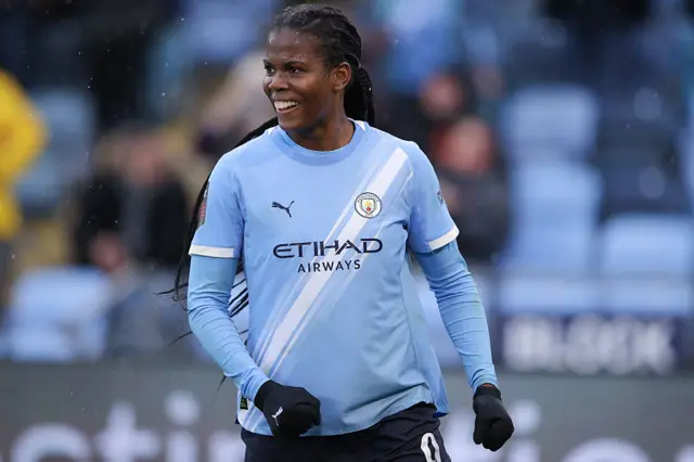 Khadija 'Bunny' Shaw smiles after scoring