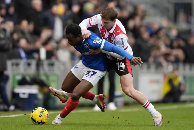 Southampton's James Bree (right) and Portsmouth's Millenic Alli battle for the ball
