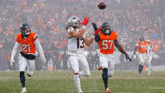 Mack Hollins of the New England Patriots makes a catch against the Denver Broncos