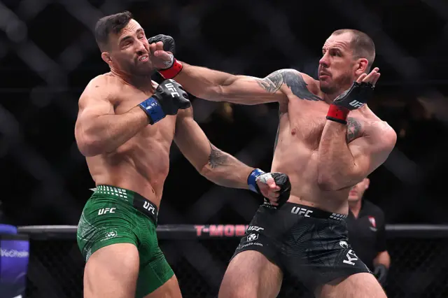 Nikita Krylov of Ukraine strikes Modestas Bukauskas of Lithuania