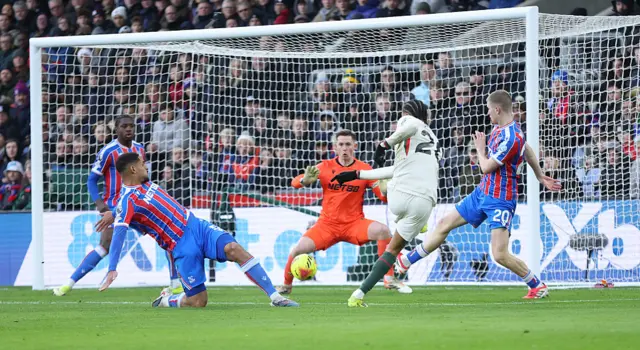 Dean Henderson having to be at full stretch to get one hand on Estevao's strike