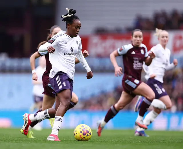 Melvine Malard runs with the ball