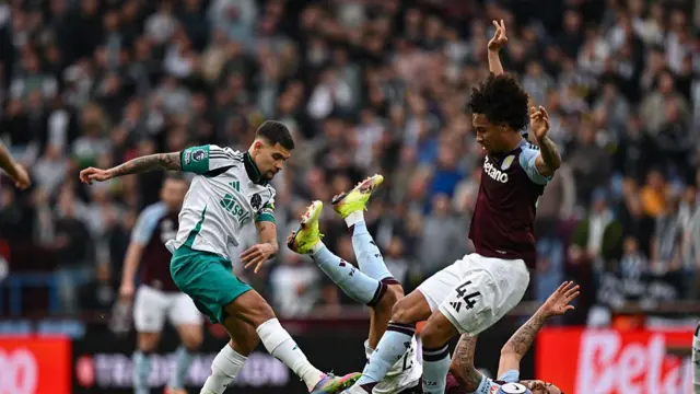 Bruno Guimaraes is tackled by Boubacar Kamara during Newcastle United's game against Aston Villa on 19 April, 2025