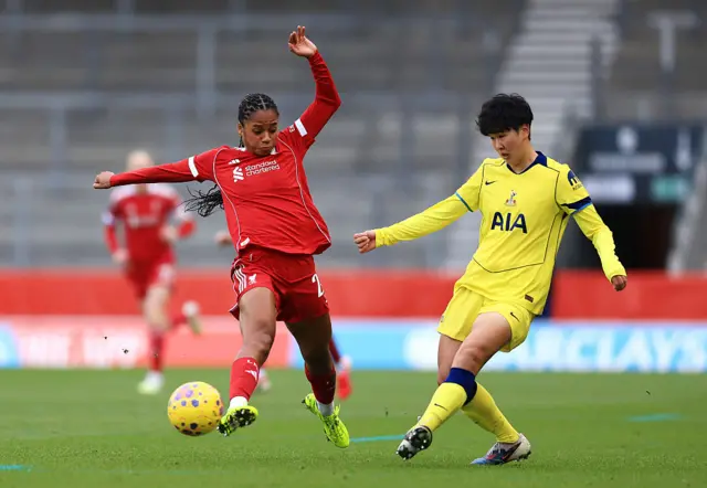 Toko Koga and Aurelie Csillag compete for the ball