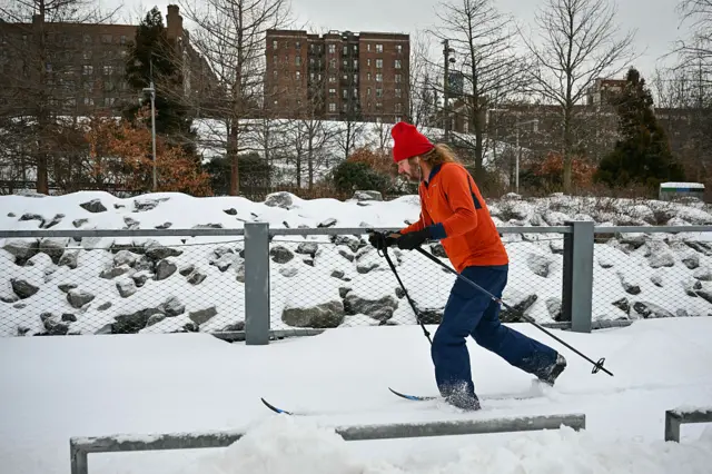 A man skis along a path in the Brooklyn borough of New York City.