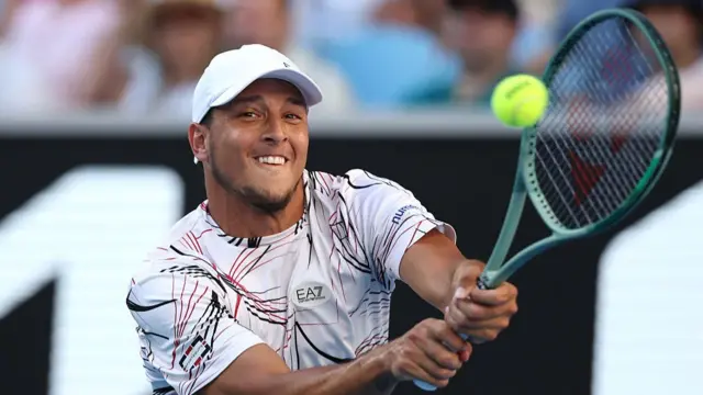 Luciano Darderi hits a backhand