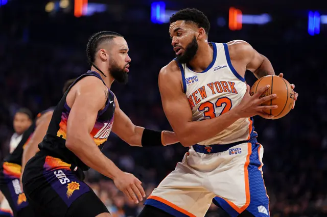 Towns, playing basketball