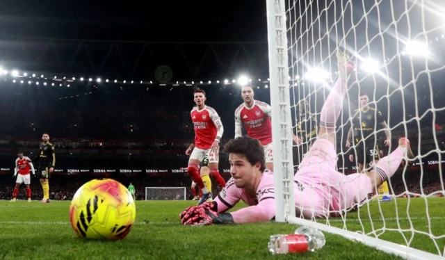 Manchester United's Senne Lammens in action as he saves a shot