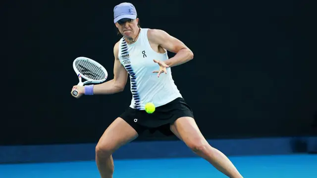 Iga Swiatek hits a forehand