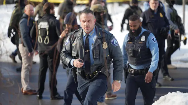 Brian O'Hara walks wearing a police uniform