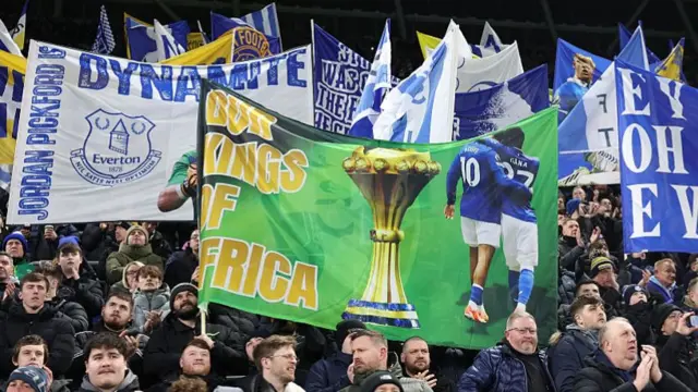 Everton fans welcome back Gueye and Ndiaye with a 'Kings of Africa' banner'