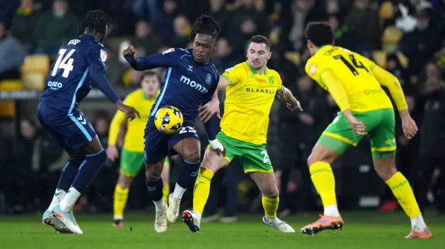 Brandon Thomas-Asante tries to find space past Norwich's Kenny McLean