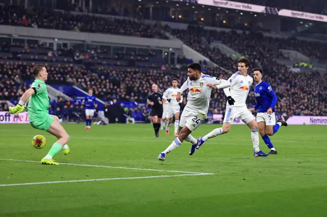 Justin slots a finish low between Pickford's legs