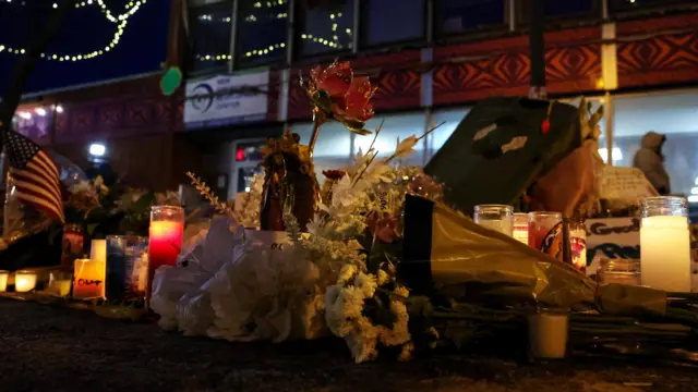Flowers and candles on the ground in Minneapolis