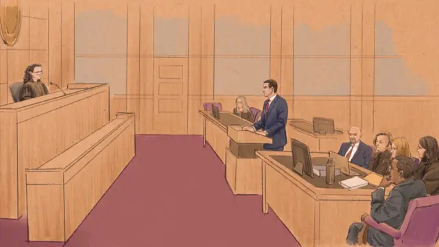 Court sketch of Justice Department attorney addressing a judge seated on the left