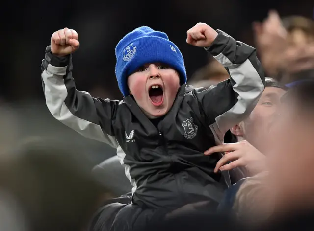 A kid shouts in delight after the Everton goal