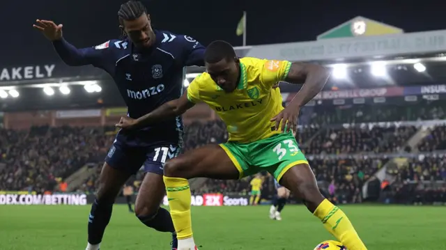 Norwich's Jose Cordoba shields the ball from Coventry striker Haji Wright