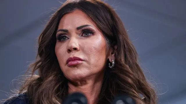 Kristi Noem speaks at a podium