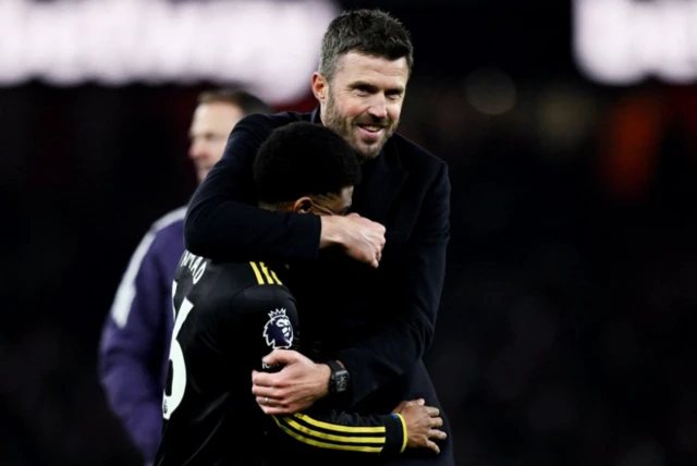 Manchester United's Amad Diallo celebrates after the match with Manchester United manager Michael Carrick