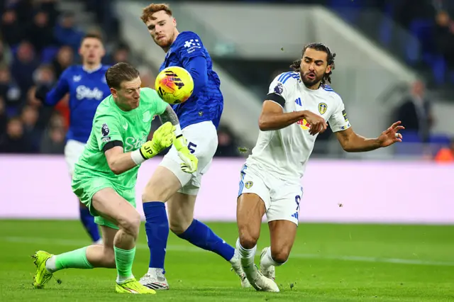 Calvert-Lewin is bundled off the ball by Pickford and O'Brien