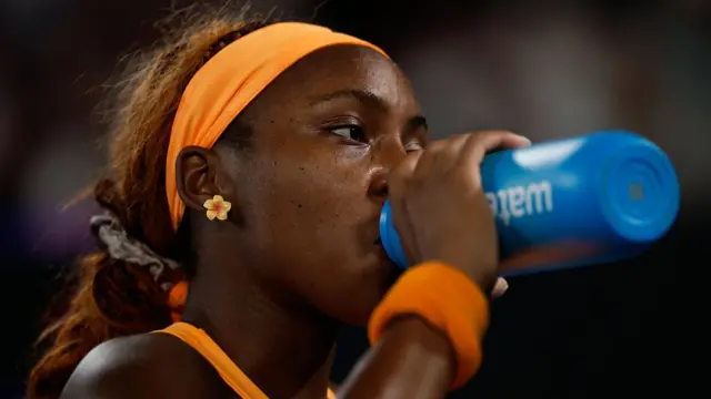 Coco Gauff  takes a drink
