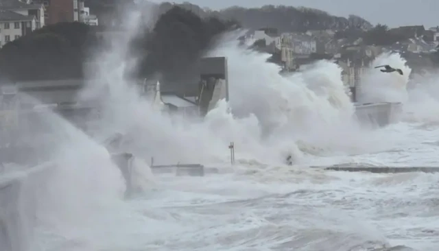 Waves are seen hitting the sea wall in Dawlish.