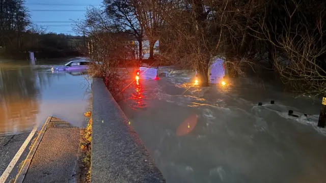 Vehicles stuck in floodwater