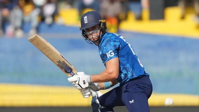 Jacob Bethell of England playing a shot