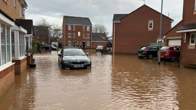 A car stranded in flood water on Severn Drive in Taunton.