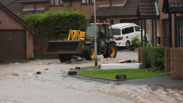 Street that looks like a river due to the storm and subsequent floods.
