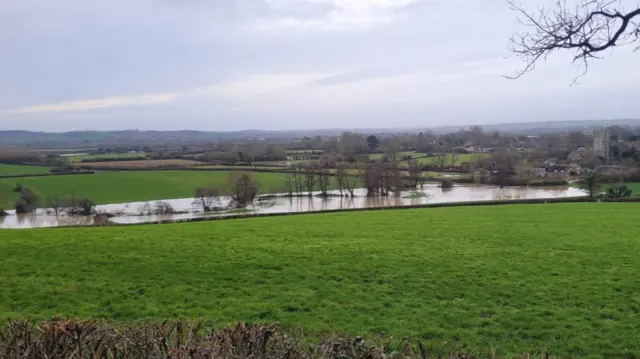 Flooded fields in the distance.