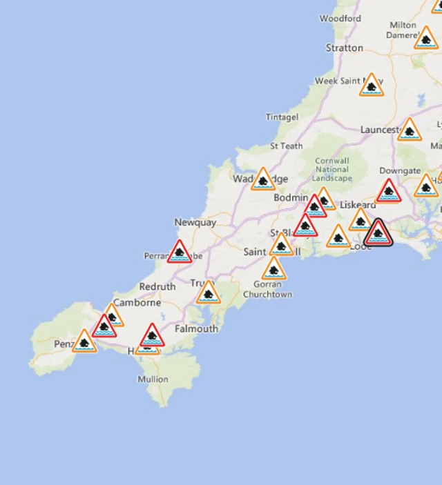 A map with red triangles showing flooding symbols.