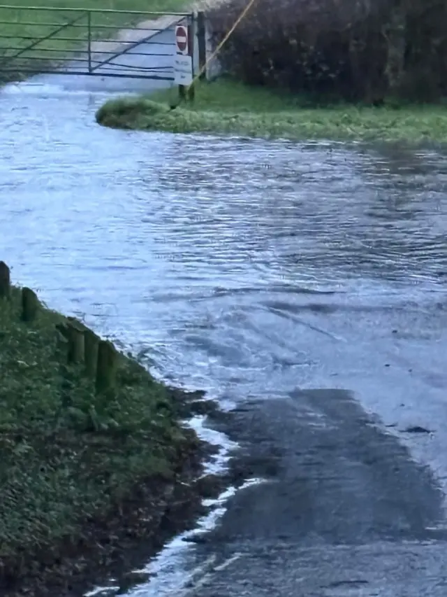 A flooded the flooded South Baddesley Road by Elmers Court Hotel & Resort in Lymington.