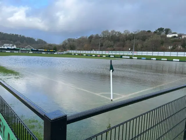A football pitch flooded.
