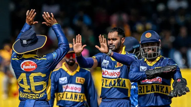 de silva celebrates taking the wicket of ben duckett