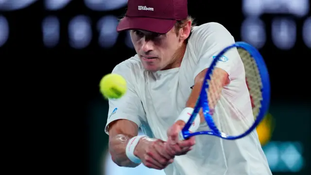 Alex de Minaur hits a backhand
