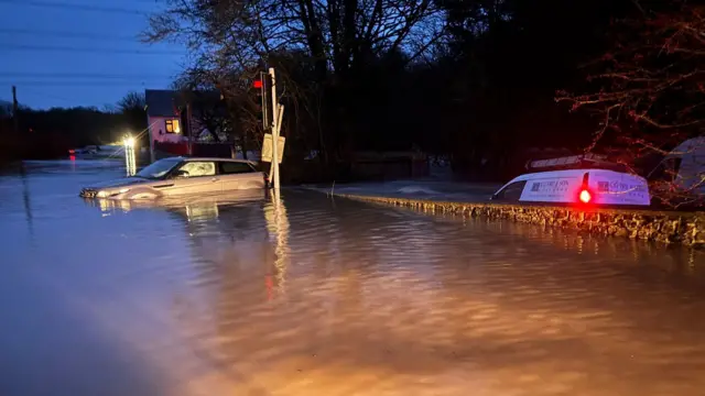 Vehicles stuck in floodwater
