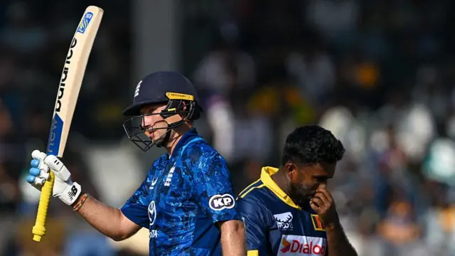 England's Joe Root celebrates after scoring a half-century