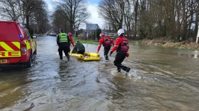 Flood rescue with yellow inflatable