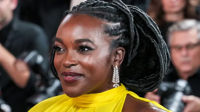 Wunmi Mosaku in a bright yellow dress at the Golden Globes