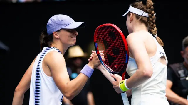 Iga Swiatek shakes hands with Elena Rybakina