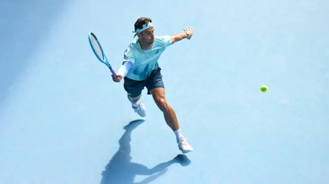 Lorenzo Musetti hits a forehand