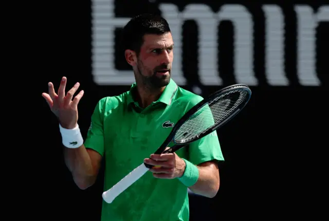 Novak Djokovic shrugs